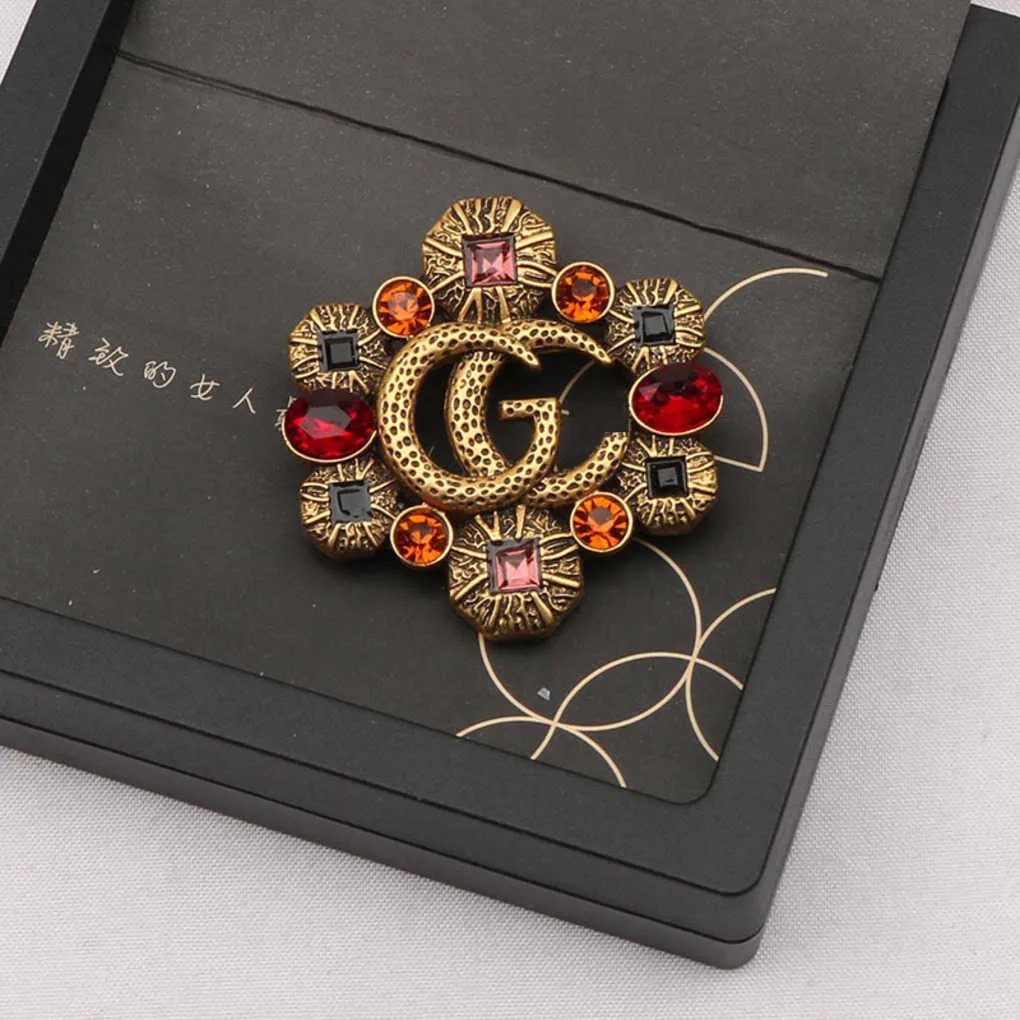 Fashion Collection 2023 New Luxury High Quality Fashion Jewelry for New hollowed out color diamond zircon inlaid Brooch anti light coat pin female