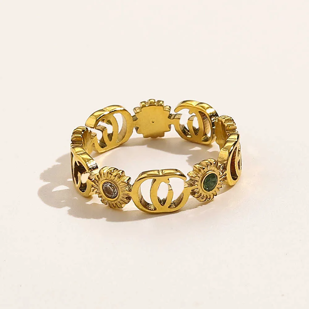 Design lyxiga smycken daisy rostfritt titanstål bronsblomma set zirkonpar ring