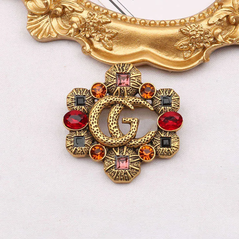 2023 New Luxury High Quality Fashion Jewelry for New hollowed out color diamond zircon inlaid Brooch anti light coat pin female