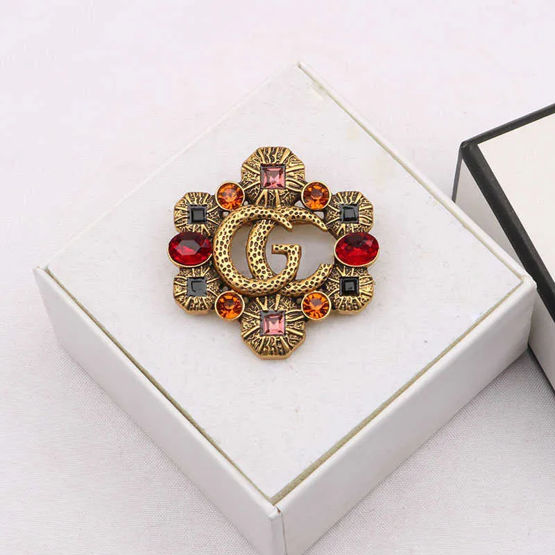 2023 New Luxury High Quality Fashion Jewelry for New hollowed out color diamond zircon inlaid Brooch anti light coat pin female