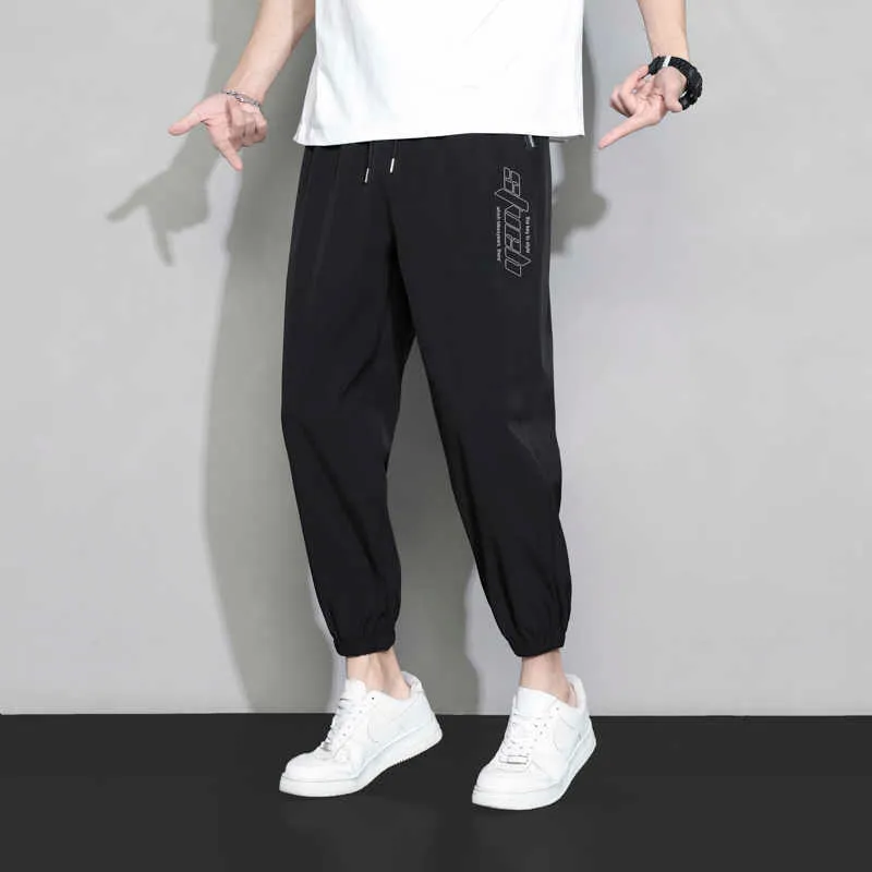 Pantalons pour hommes Hommes Ice Soie Pantalons décontractés 2023 Hommes Printemps Été Vitesse Sec Lâche Pantalons de survêtement Haute Qualité Sports de Plein Air Pull Corde Jogging Pantalon Z0306