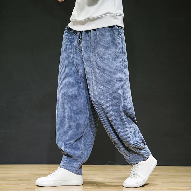 Spodnie męskie swobodne sprężyste sznurki przeciwzaprzewowe Przeciwprośne sztrukołowe luźne spodnie japońskie ulicy retro w rozmiarze plus harem 230307