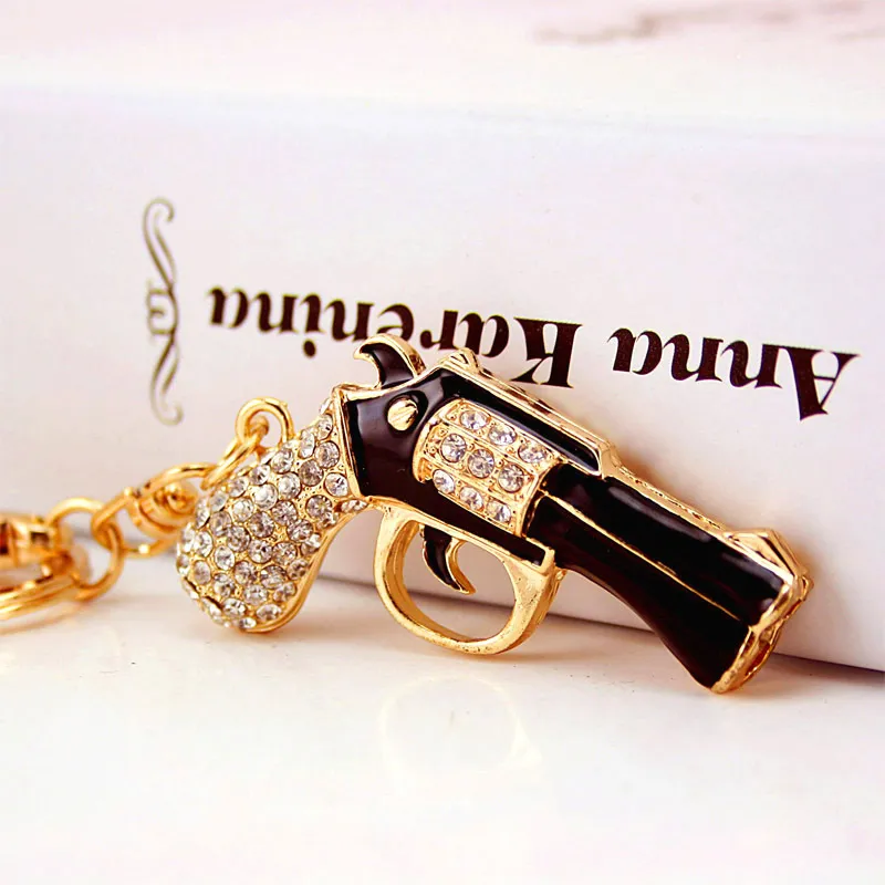 Anillos clave Lindo esmalte Revólver Magnum Pistola Llave de llave Soporte de cristal Purse Bolse Costeo para mujeres Keychanes de regalos K274 NUEVO