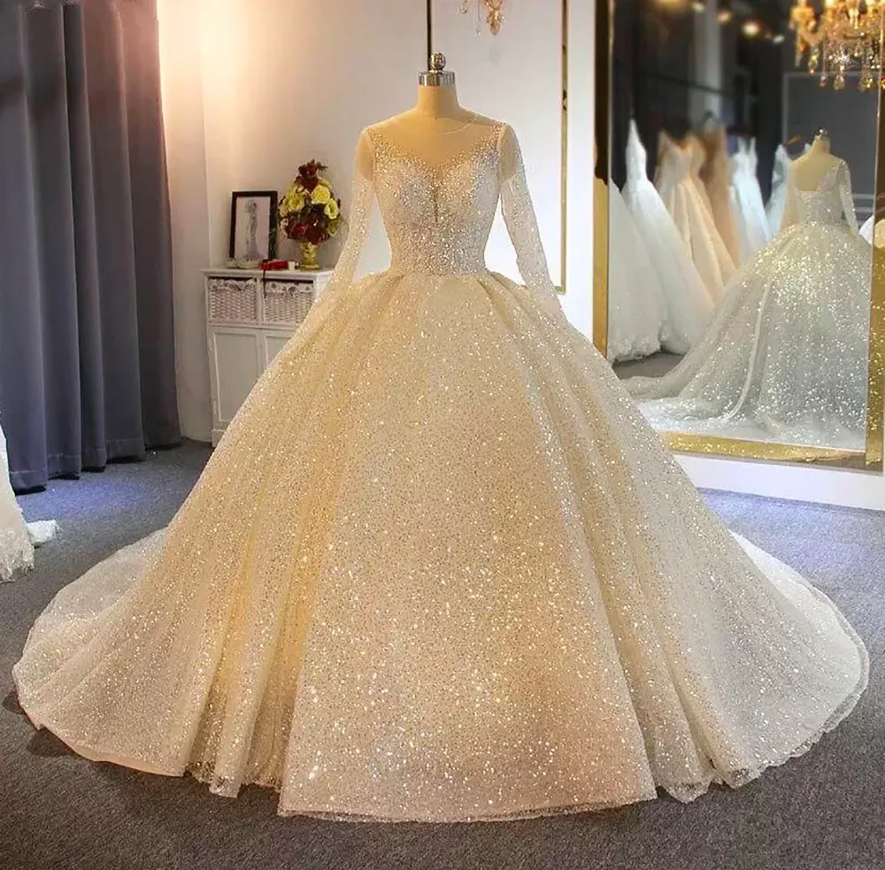 Custom-made Sparkling Ball Gown sparkly wedding dress with Sheer Jewel Neckline, Appliqued Sequins, and Long Sleeves - 2021 Collection Custom-made Sparkling Ball Gown sparkly wedding dress with Sheer Jewel Neckline, Appliqued Sequins, and Long Sleeves - 2021 Collection