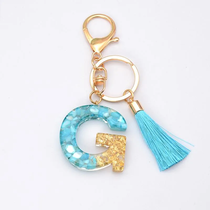 Chaves de chavel tassel azul ouro para keys jóias femininas A-Z Letters Inicial Pingente de bolsa de resina inicial AccessoriesKeyChains