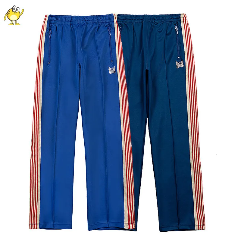 Mens Pants Joggers Blue Sweatpants Män Kvinnor Outdoor Casual Needles Pants Pull Rope Trousers Webbing Striped Butterfly Brodery 230313