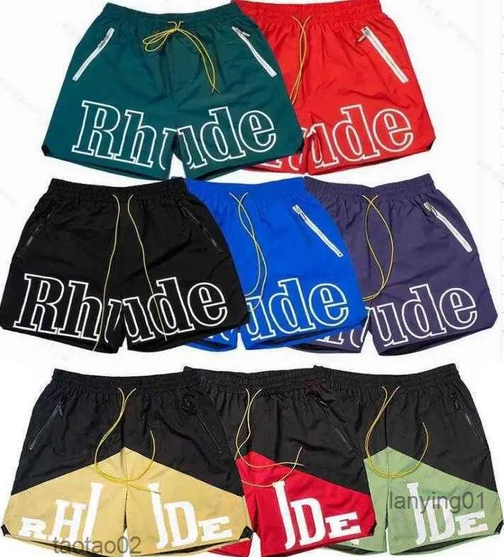 2023 Pantaloncini firmati Rhude Moda Estate Pantaloni sportivi da uomo Famosi pantaloni corti Unisex Lettere stampate Beach1ve9