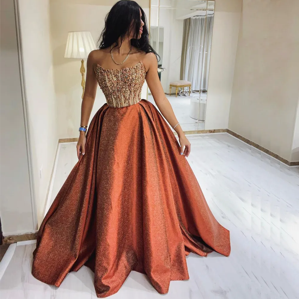 Long Graduation Dresses: Elegant Strapless Beaded Formal Gown With Sweep  Train Perfect For Prom And Special Occasions; Glitter Prom Gowns From  Missbridaldress