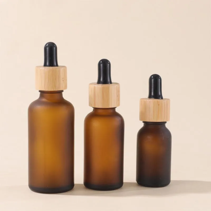 Frosted Brown Glass Cosmetic Packaging Bottles with Dropper and Bamboo Lids