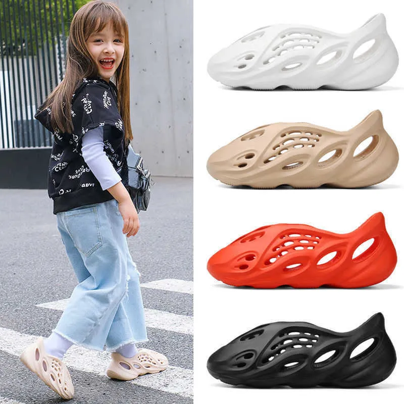 Sandalias Baotou para niños Zapatos con agujeros de coco para niños y niñas Zapatos de playa de tendencia para padres e hijos minoritarios impermeables al aire libre