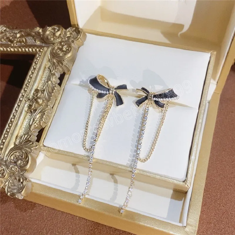 Boucles d'oreilles pendantes coréennes bijoux de mode métallisé noir nœud papillon forme pendentif Long gland cristal boucles d'oreilles pour les femmes Brincos Pendientes