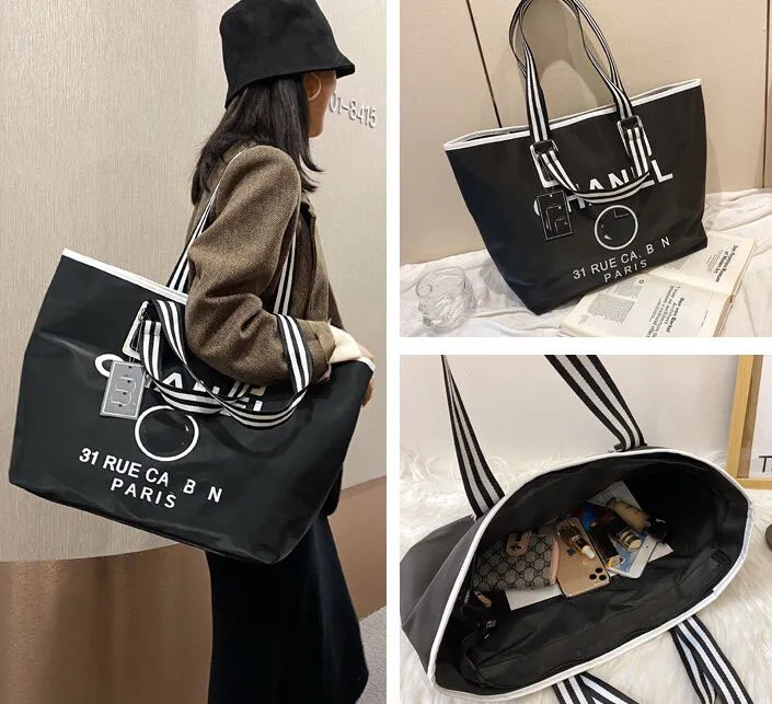 Duffel Bags Luxury Designer Brands Black white Shopping Bags Women Triangle Label Waterproof Leisure Travel Bag Large Capacity Nylon Mommy Tote P230325