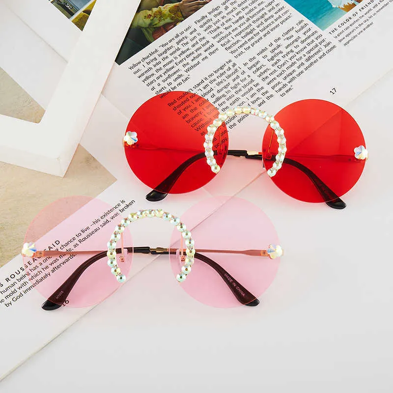 Lyxdesigner Nya män och kvinnors solglasögon 20% rabatt med diamantram personlig rund fashionabla metall