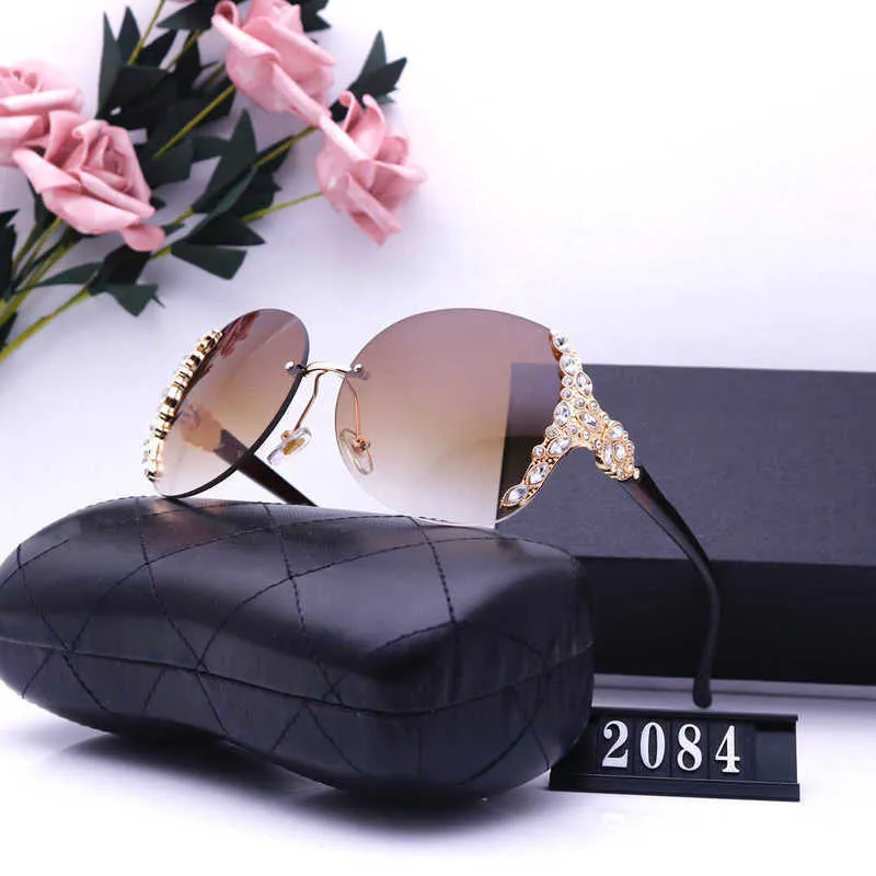 Designer de luxe Nouveaux lunettes de soleil pour hommes et femmes 20% de réduction sur les lunettes de mode de voyage de tir de rue à l'étranger 2084