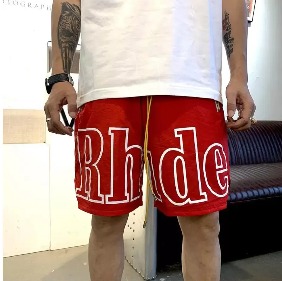 RHUDE ショーツデザイナーメンズバスケットボールショートパンツ 2021 高級夏ビーチヤシの文字メッシュストリートファッションスウェットパンツ