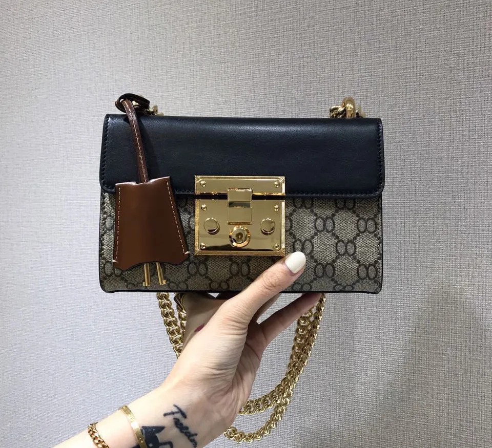 Modedesigner axelväskor lyxiga damhänglås handväskor brev läder kedjor crossbody clutches dam vintage Double G sling plånböcker