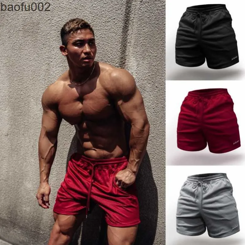 Mäns shorts 2022 Summer Men Mesh Shorts Casual Gym Bodybuilding Fitness Apport Beach Man andningsbara joggermärke Snabbt torrträning Shorts W0327
