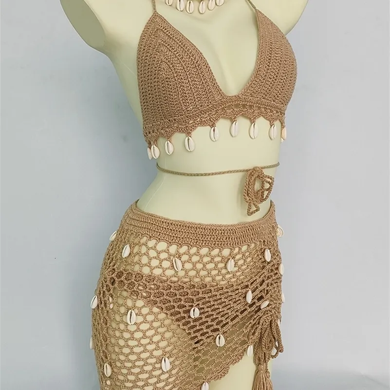 Mulheres Swimwear Mulher Bikini Set Crochet Shell Tassel Top Sexy Thong Bottom Ver Através Oco Out Bandage Cintura Alta Saia Curta Praia 230329