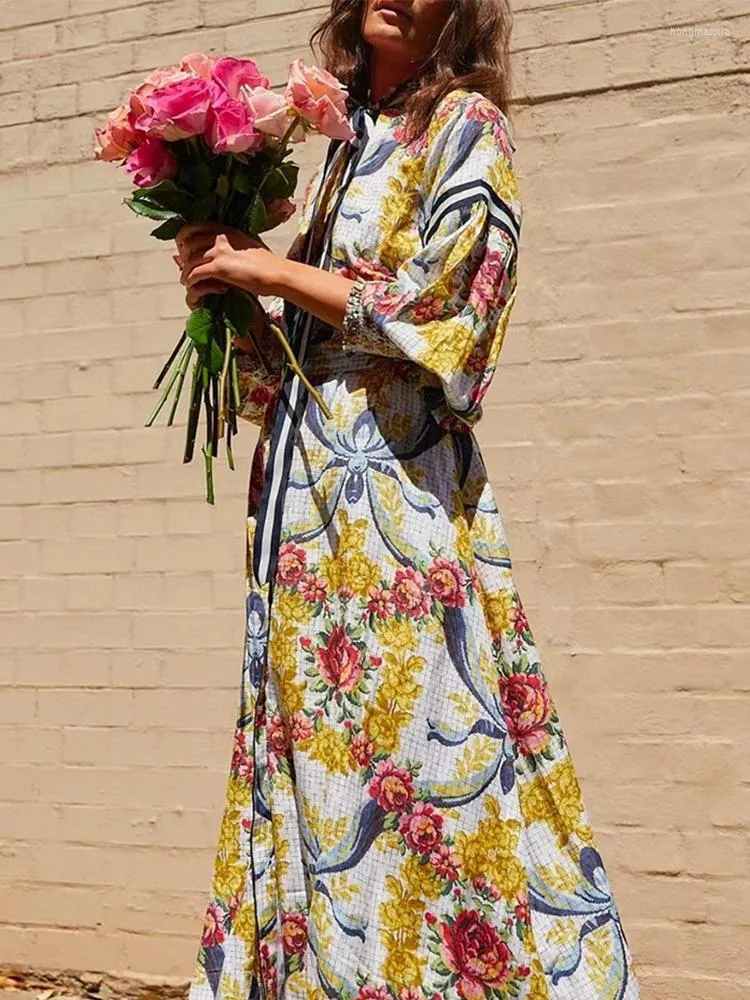 カジュアルドレスファッション2023秋のシチリアドレス女性ランタンスリーブシングル胸の花の印刷ベルトホリデーロング