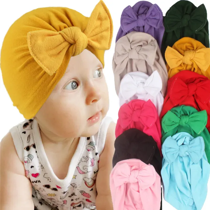 Bambino appena nato Bowknot Cappelli Grandi fiocchi Copricapo Copricapo Fascia floreale Copricapo infantile Berretti Bambini Gilrs Fascia per capelli Paraorecchie Cap