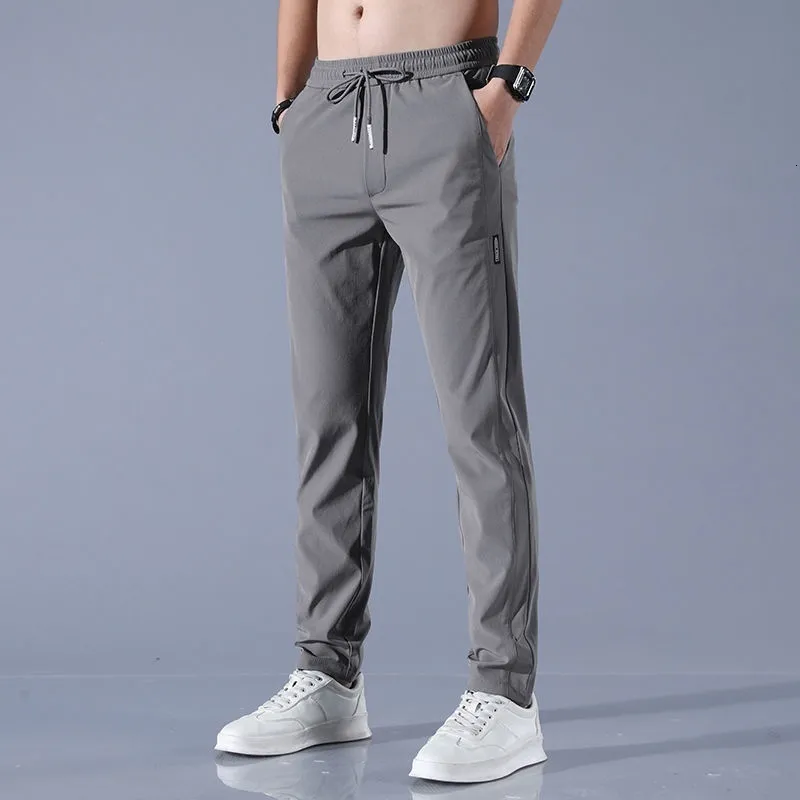Męskie spodnie Wysokiej jakości męskie spodnie męskie koreańskie szczupłe spodnie swobodne spodni rozciągnij długie spodnie chinos spodni męskie spodnie 230504