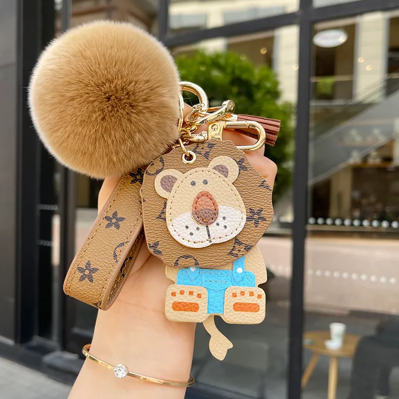 Клавичные коррекции Lanyards Caychain Designer Bag charm women mite little lion classic chlass car car pendant men cartoon carty pare geash gift изящно