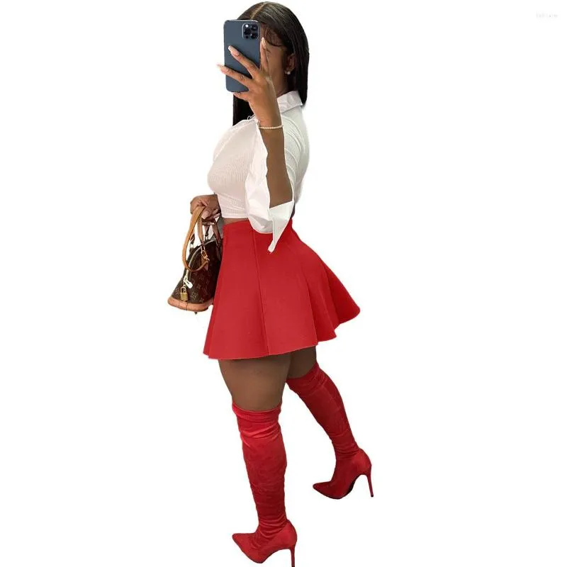 Red mini skirt white blouse 2025