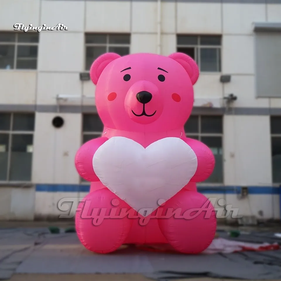 Söt gigantisk rosa reklam Uppblåsbar Bear Balloon Cartoon Animal Mascot -modell med ett stort hjärta för parkdekoration