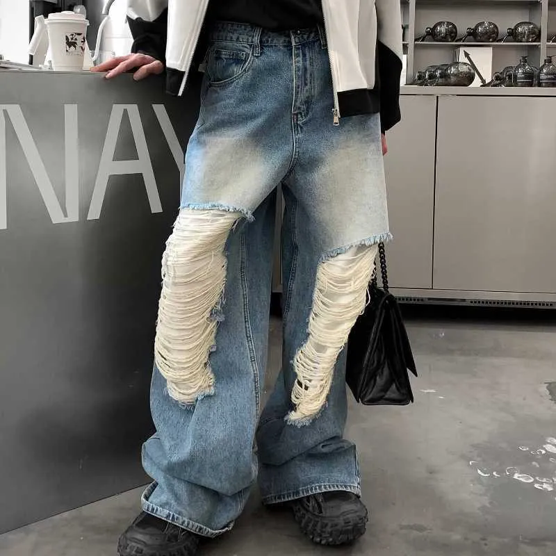 Jeans uomo larghi strappati shop