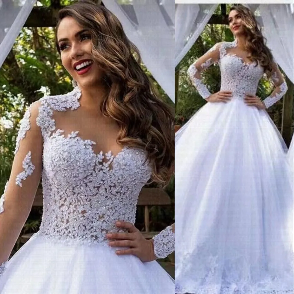 2023 Luxury Sexy A Line Wedding Dresses Long Sleeves Spets Sheer Crew Neck Lace Applicques Crystal Pärled Vestios de Novia Bridal Gowns Princess Beach Wedding Dress