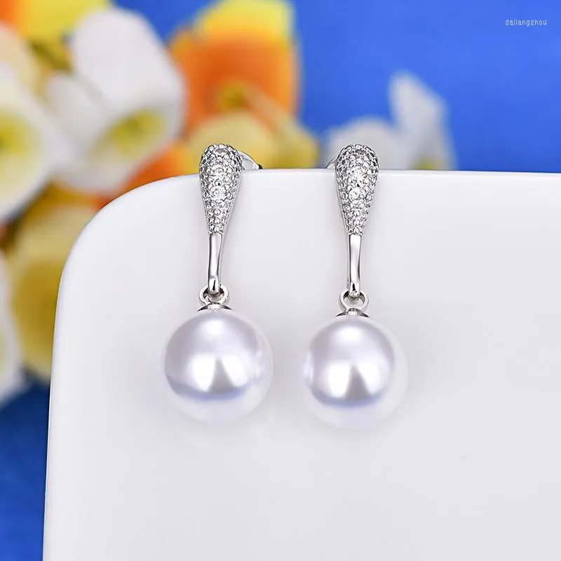 Boucles d'oreilles à la mode magnifique pendentif aiguille en argent 925 boule de cornaline CZ conviennent à une paire de bijoux de perle blanche femme