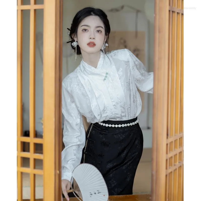 White satin blouse black satin skirt 2025