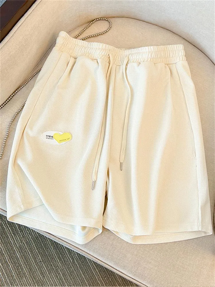 Kvinnors shorts sommar mode kvinnors elastiska midja premium våffla kvinnlig söt patch fast färg enkel avslappnad halvlängd byxor