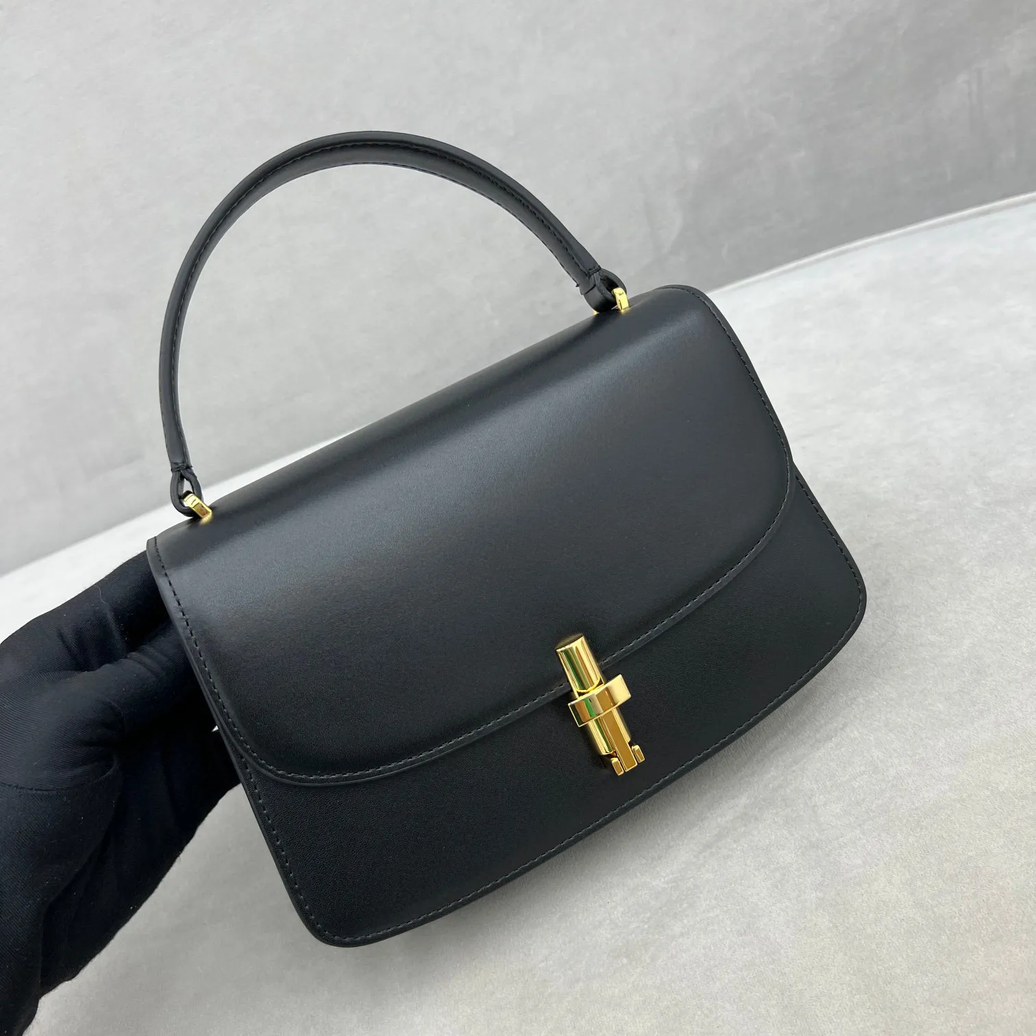 Black and top brown designer handbags