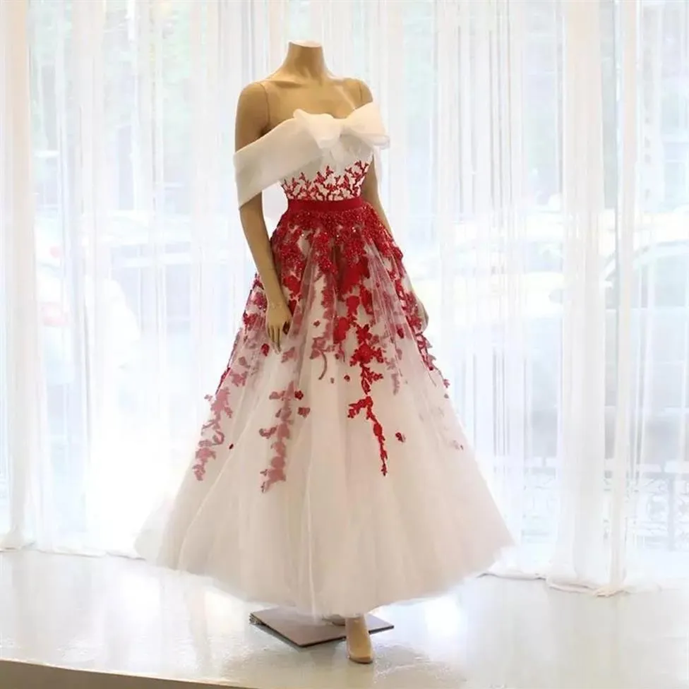White dress shop with red bow