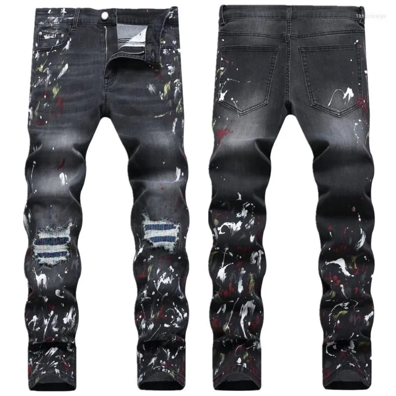 Mäns jeans trend av hög kvalitet rippade män målar tryckt hål patch märke motorcykel denim byxor mens svart elastisk mager