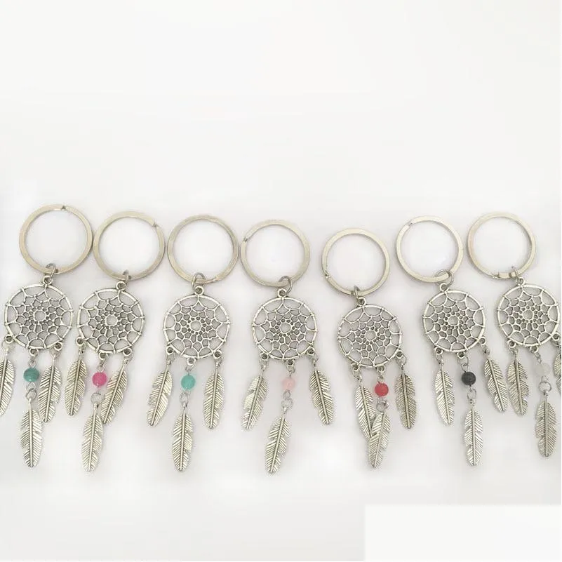 Nyckelringar Ny mode Fånga drömbilskedjan Feather Metal Keychain Men Women Holder Valentine's Gift 920 Q2 Drop Leverans smycken Otgxu