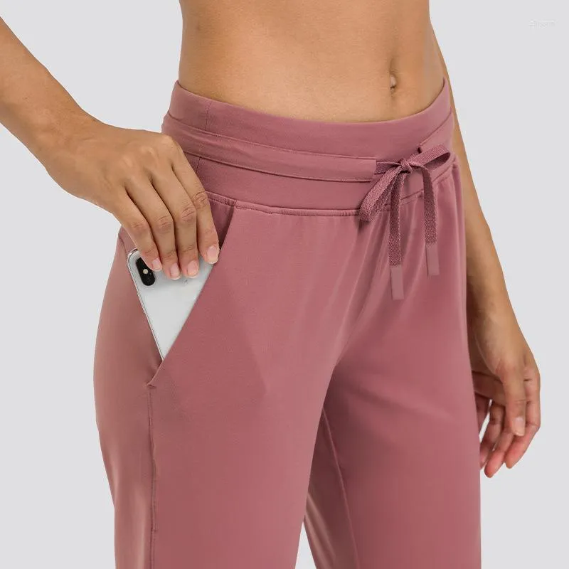 Pantalon actif couleur unie doux femmes formation complète Sport pantalon Fintess Yoga Legging cordon pieds pantalon poche usine personnalisé