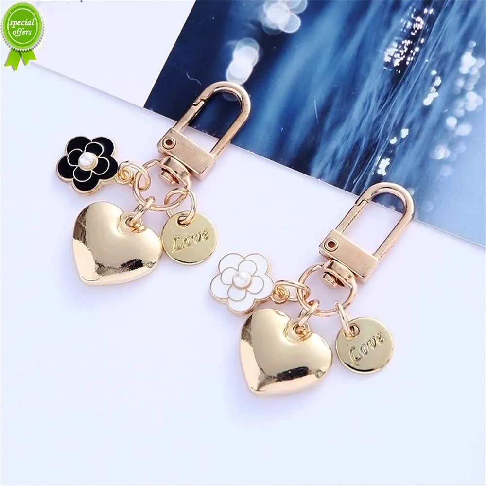 Nouveau nouveau porte-clés coeur en métal mode lettres camélia pendentif rond pour femmes filles étui pour casque accessoire sac bibelot cadeau de fête