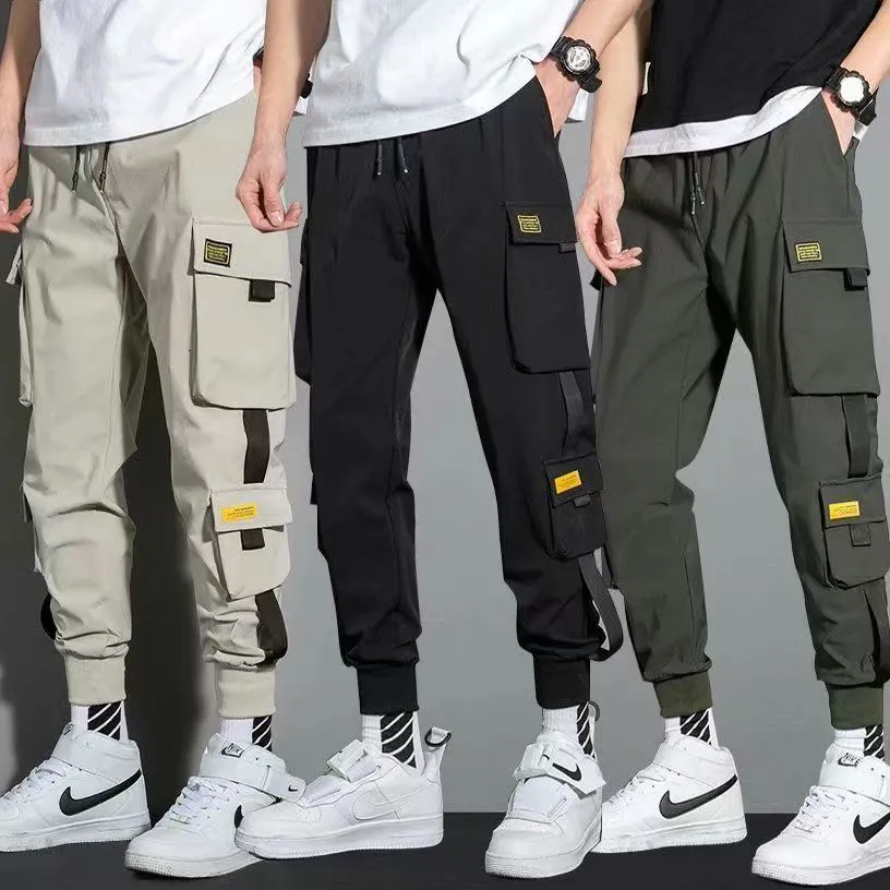 Pantalons pour hommes minces Streetwear pantalons décontractés hommes rubans Harem pantalons de jogging mâle Slim Fit printemps Cargo pantalon multi-poches femmes pantalon Jx1 230519