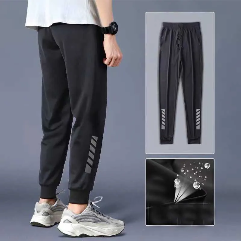 Męskie spodnie sportowe dla mężczyzn Joggers moda spodnie męskie ubranie czarne lodowe jedwabne oddychające spodnie streetwearne splasy elastyczne spodnie dresowe 2022