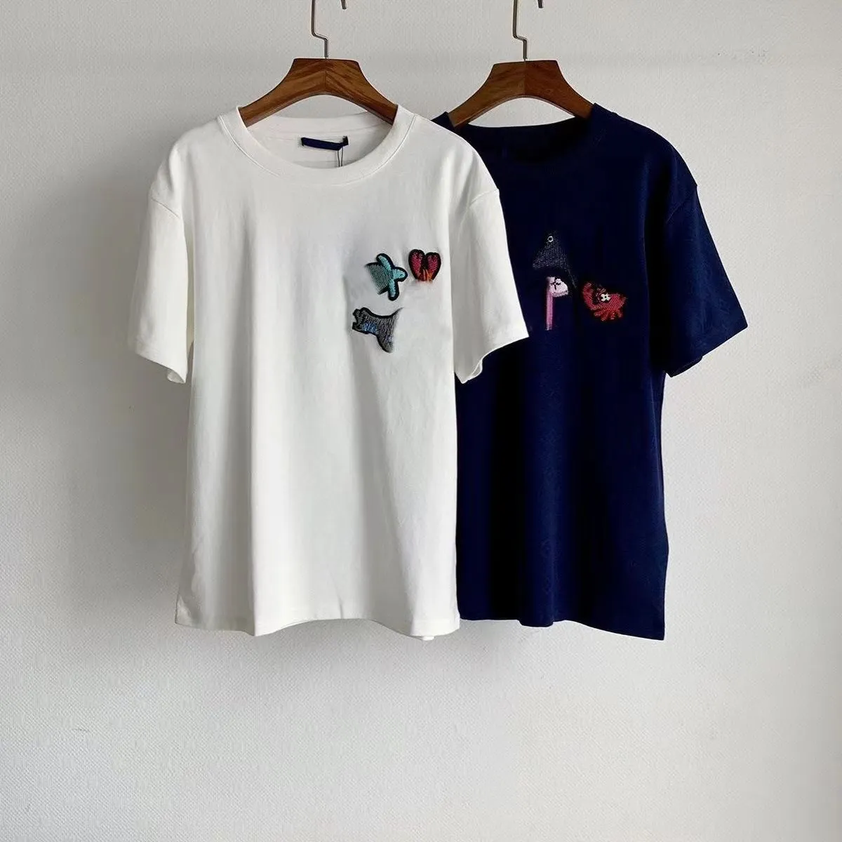 Camiseta de diseñador para hombre, marca de dibujos animados, top holgado clásico, ropa de calle informal de lujo para hombre, camiseta de tendencia de manga corta