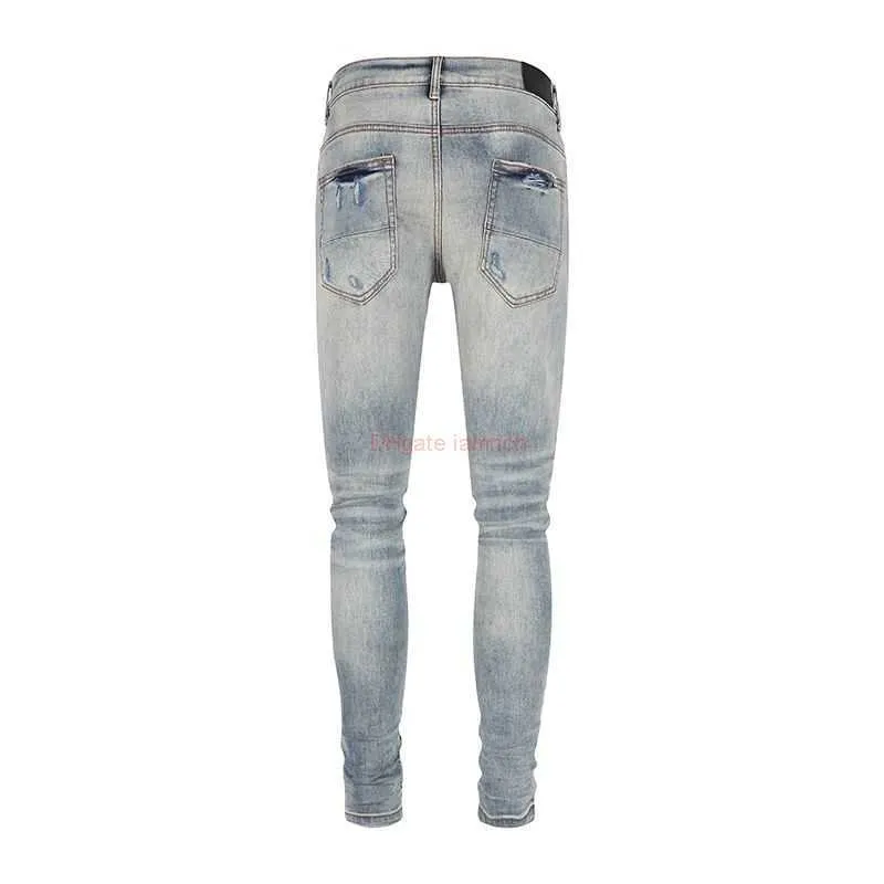 Roupas de grife Amires Jeans Cal a jeans 2023 Nova Amies High Street Moda Cal a jeans masculina na moda com buracos quebrados Remendos plissados Cal a