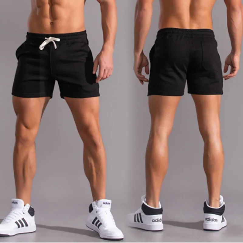 Nya män bomullssportbyxor som kör fitnessbyxor trendiga män 3/4 byxor hög elasticitet avslappnad 4/4 byxor av hög kvalitet mode heta försäljning shorts