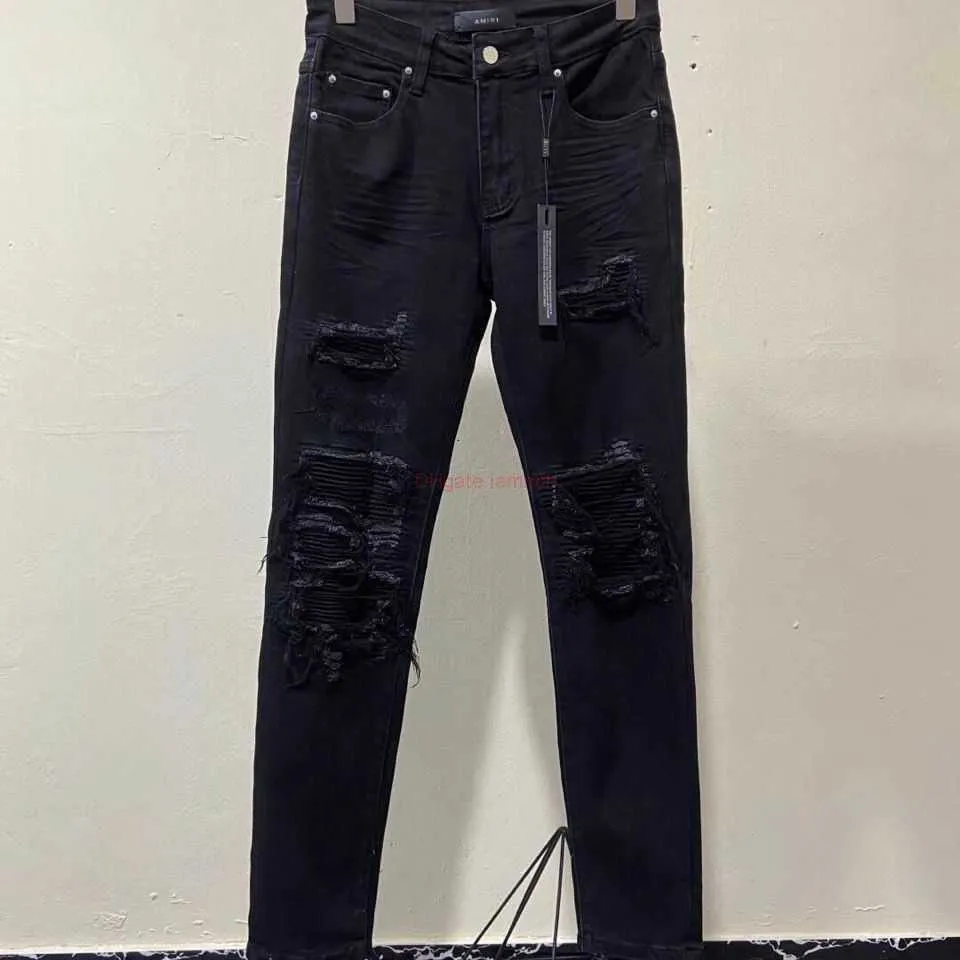 Jean noir a trou on sale
