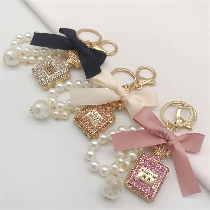 Luxe cristal bouteille porte-clés voiture porte-clés noeud papillon femmes sac sac à main pendentifs cadeau bijoux
