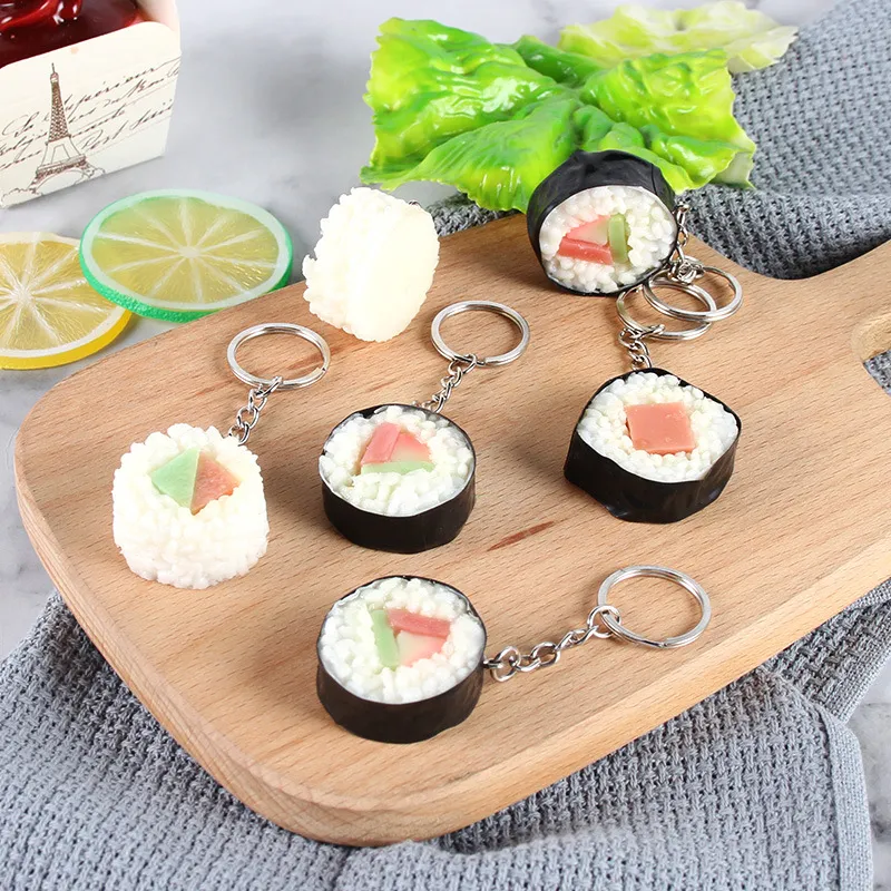 Nieuwe trendsimulatie Japanse rijstbal Sushi Keychain Creative Food Play Model Bag Pendant Chic Gift