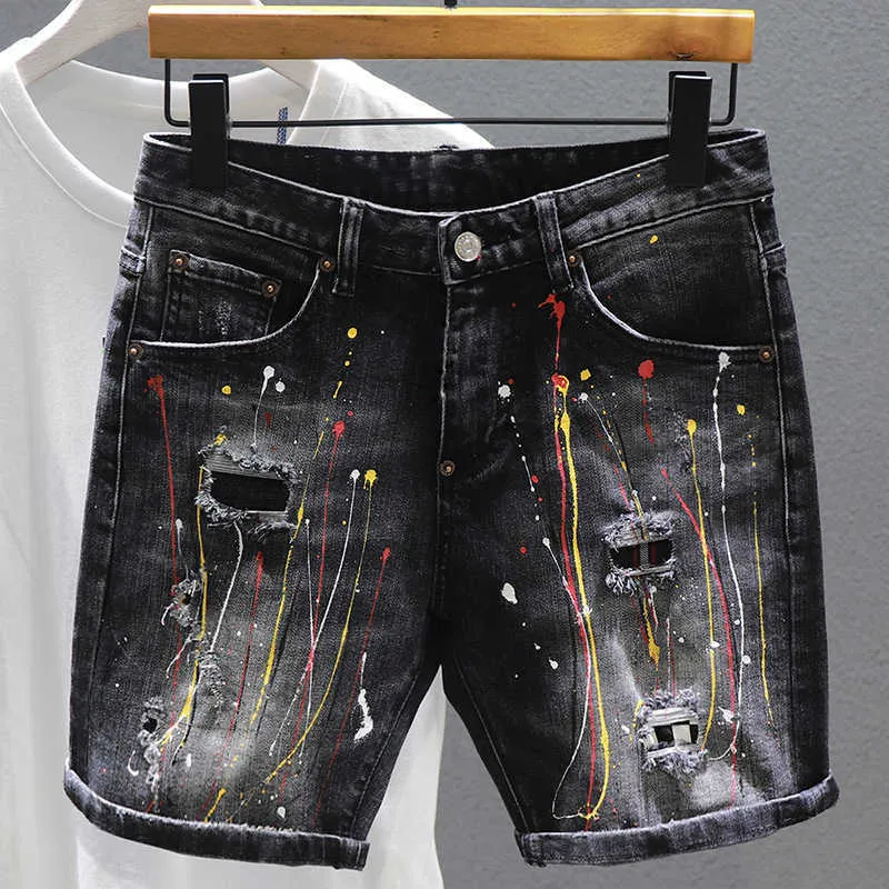 Pantaloncini da uomo Denim buco incrinato Estate nuova vernice graffiti patch moda hip-hop bava pantaloncini jeans uomo dritto P230525