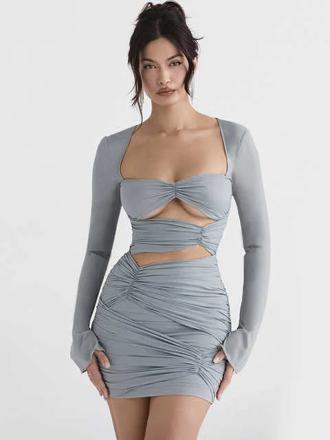 High-waisted long-sleeved dress with cinched waist and tie detail.