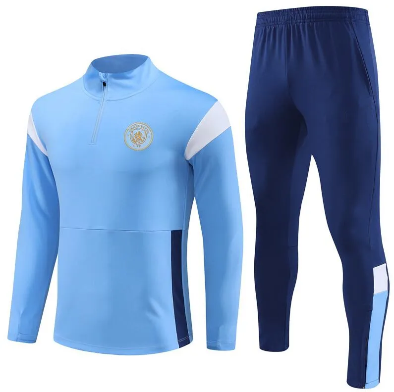 Man city tracksuit junior deals